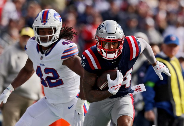 New England Patriots wide receiver Kendrick Bourne races away from Buffalo Bills linebacker Dorian Williams during the second quarter of a home victory over the Bills. (Nancy Lane/Boston Herald)