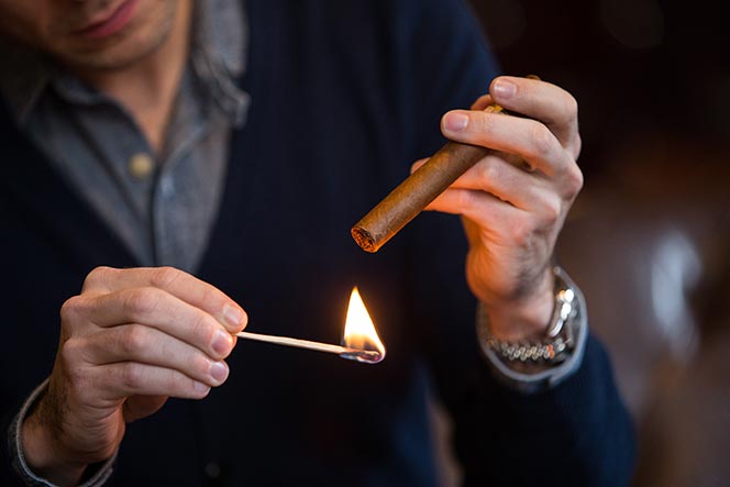 light-a-cigar-toasting-foot-with-match-1.jpg