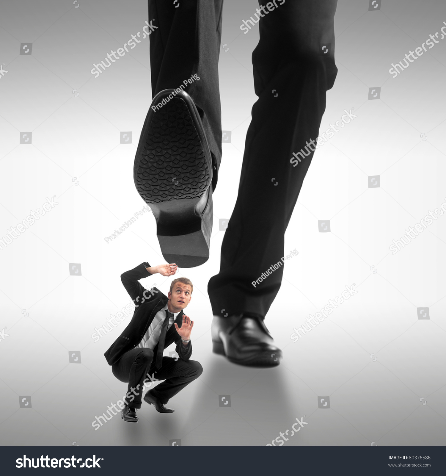 stock-photo-little-business-man-being-crushed-by-the-feet-of-a-giant-business-man-80376586.jpg