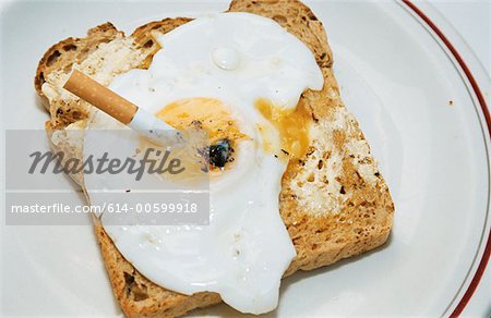 614-00599918em-Cigarette-butt-and-fried-egg.jpg
