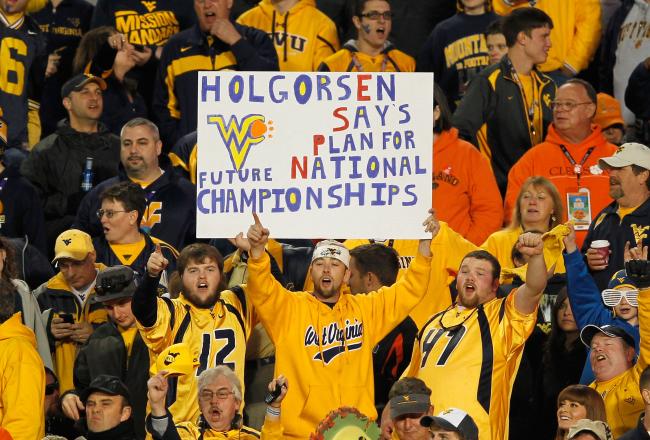 hi-res-137251177-fans-of-the-west-virginia-mountaineers-hold-up-a-sign_crop_north.jpg
