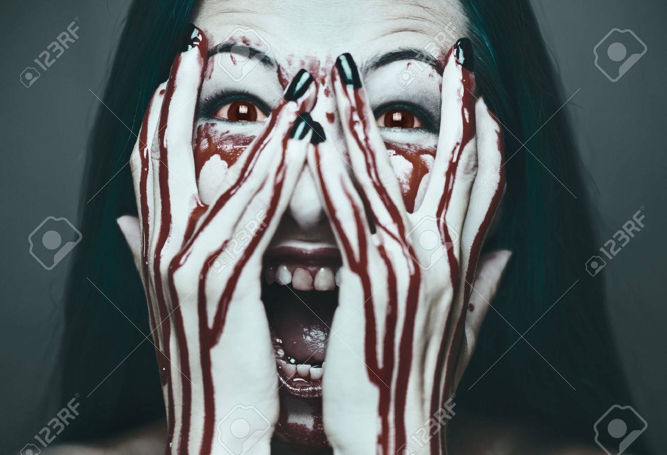 47339602-Spooky-young-woman-screaming-her-face-and-hands-in-blood-Halloween-and-horror-theme-Monochrome-image-Stock-Photo.jpg
