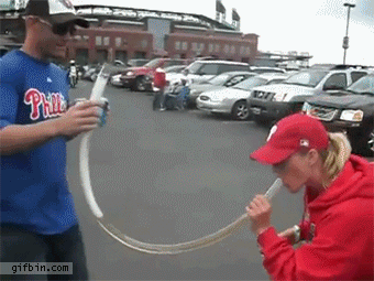 1369936459_phillies_fan_drinking_from_bong_gets_a_highfive_from_cop.gif