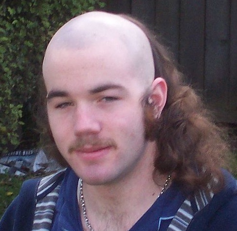 A-photograph-of-a-redneck-with-a-mullet-and-skullet-hairstyle-for-his-long-hair.jpg