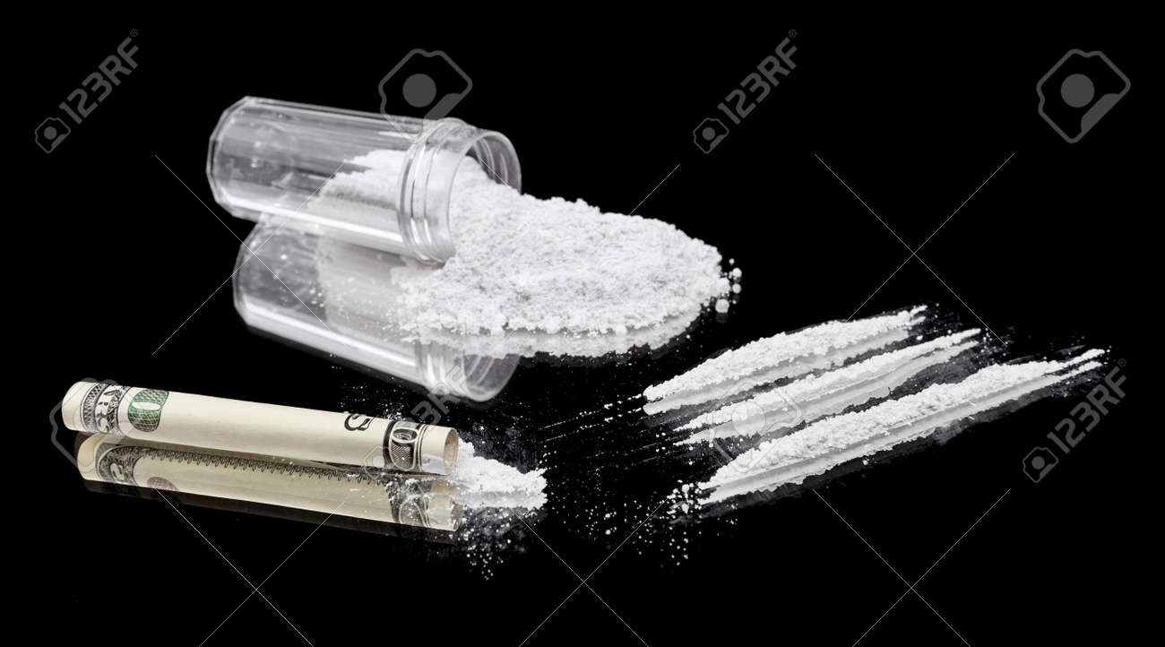 13418247-Three-lines-of-cocaine-beside-a-rolled-up-bill-and-vial-of-powder--Stock-Photo.jpg