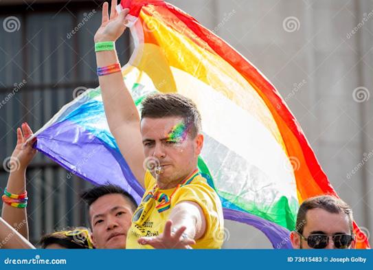lgbt-gay-pride-parade-man-rainbow-flag-london-june-73615483.jpg.cf.jpg