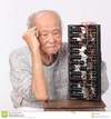 old-man-use-chinese-abacus-thinking-48649557.jpg