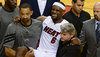 lebron-james-carried-off-court-leg-cramp-nba-finals.jpg