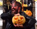 151622610-demon-with-horns-and-mad-face-holds-jack-o-lantern.jpg
