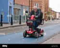 an-old-man-on-a-mobility-scooter-london-united-kingdom-HMG402.jpg