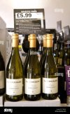 bottles-of-french-chardonnay-white-wine-for-sale-in-a-majestic-wine-C2JKA6.jpg