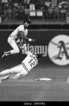 new-york-yankees-second-baseman-willie-randolph-jumps-high-over-texas-rangers-juan-beniquez-as...jpg