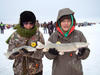 020115.N.GFH_.ICEFISHING-Women%20holding%20fish.jpg