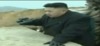 Kim-Jong-Un-binoculars-crying-baby-gorilla.gif