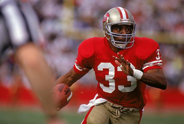 san-francisco-running-back-roger-craig-of-the-san-francisco-49ers-looks-for-room-to-run-against.jpg