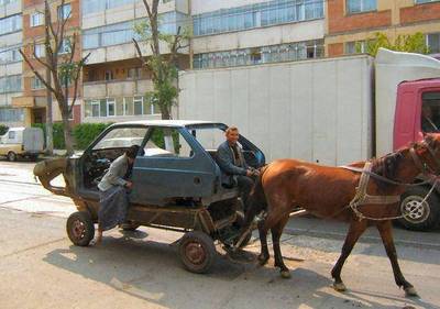 horse-pulling-a-car-in-romania.jpg