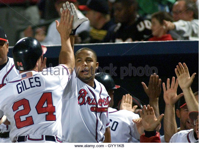 atlanta-braves-marcus-giles-24-is-greeted-at-the-dugout-by-teammates-gyy1kb.jpg