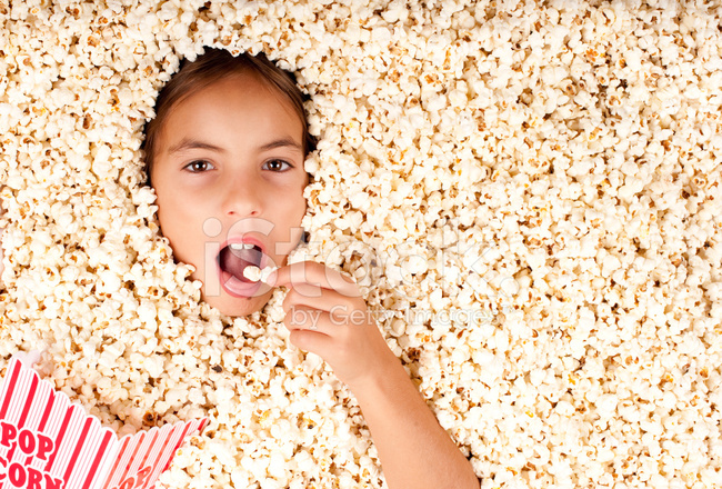 21429367-girl-buried-in-popcorn.jpg