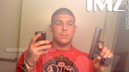 130626211602-aaron-hernandez-holding-gun-c1-main.jpg