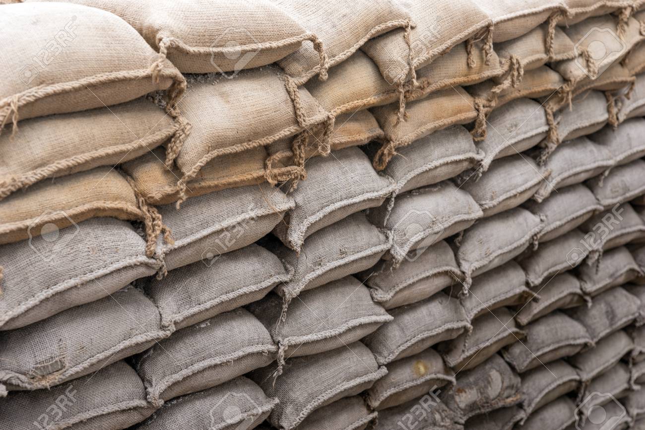 58918469-background-of-sandbags-for-flood-defense-or-military-use.jpg