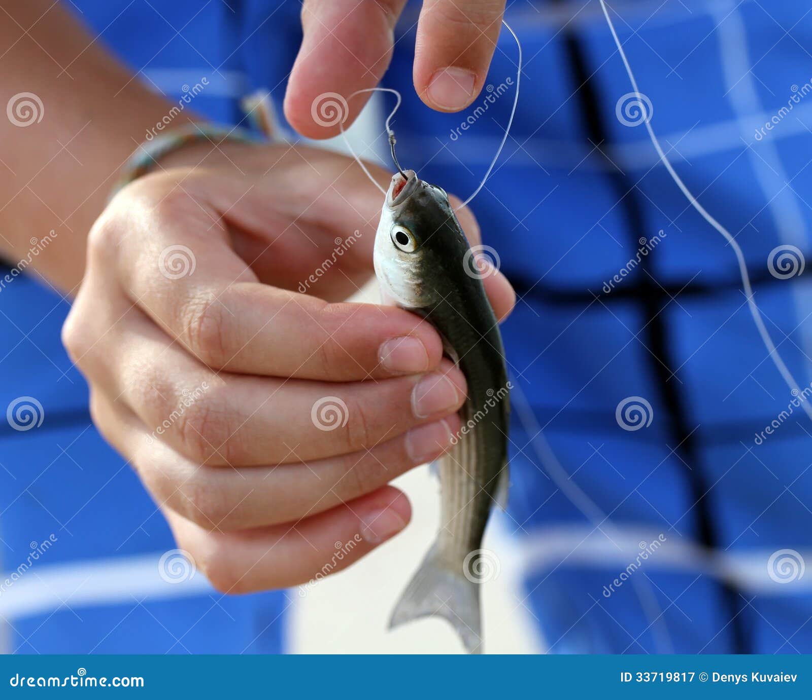 little-fish-caught-hook-arms-33719817.jpg