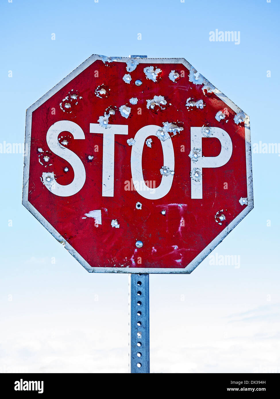 stop-sign-with-bullet-holes-DX394H.jpg