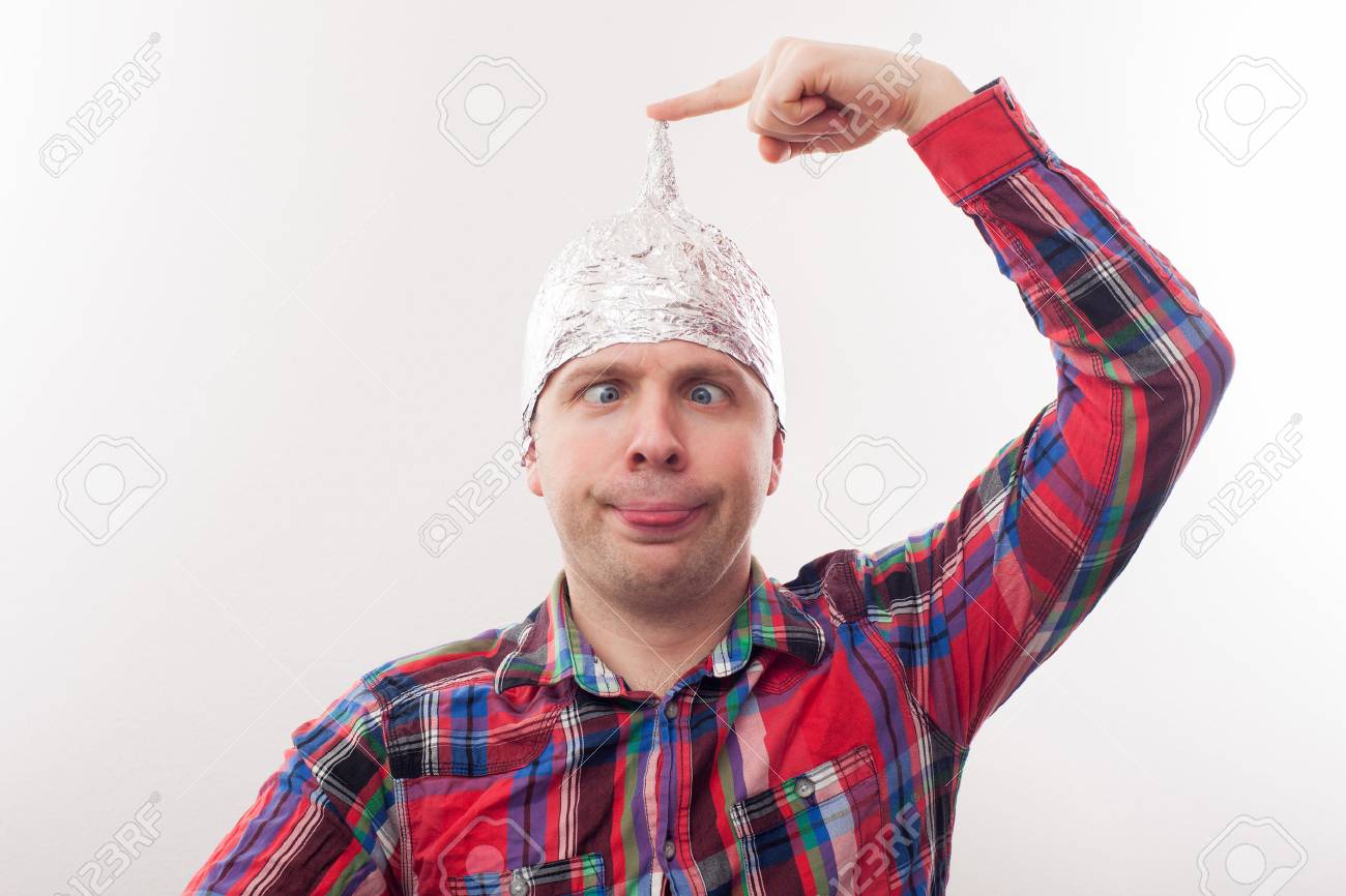 74639681-young-man-in-a-tin-foil-hat-poses-funny-faces-afraid-of-radiation-or-aliens.jpg