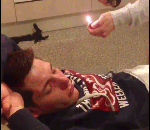 asleep-guy-prank-burn-face-spray-13933763533.gif