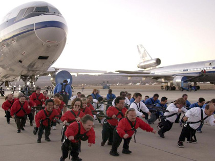 little-people-pulling-plane.jpg