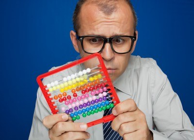 10024128-business-man-with-abacus-toy-calculator-over-blue-background%5B1%5D.jpg