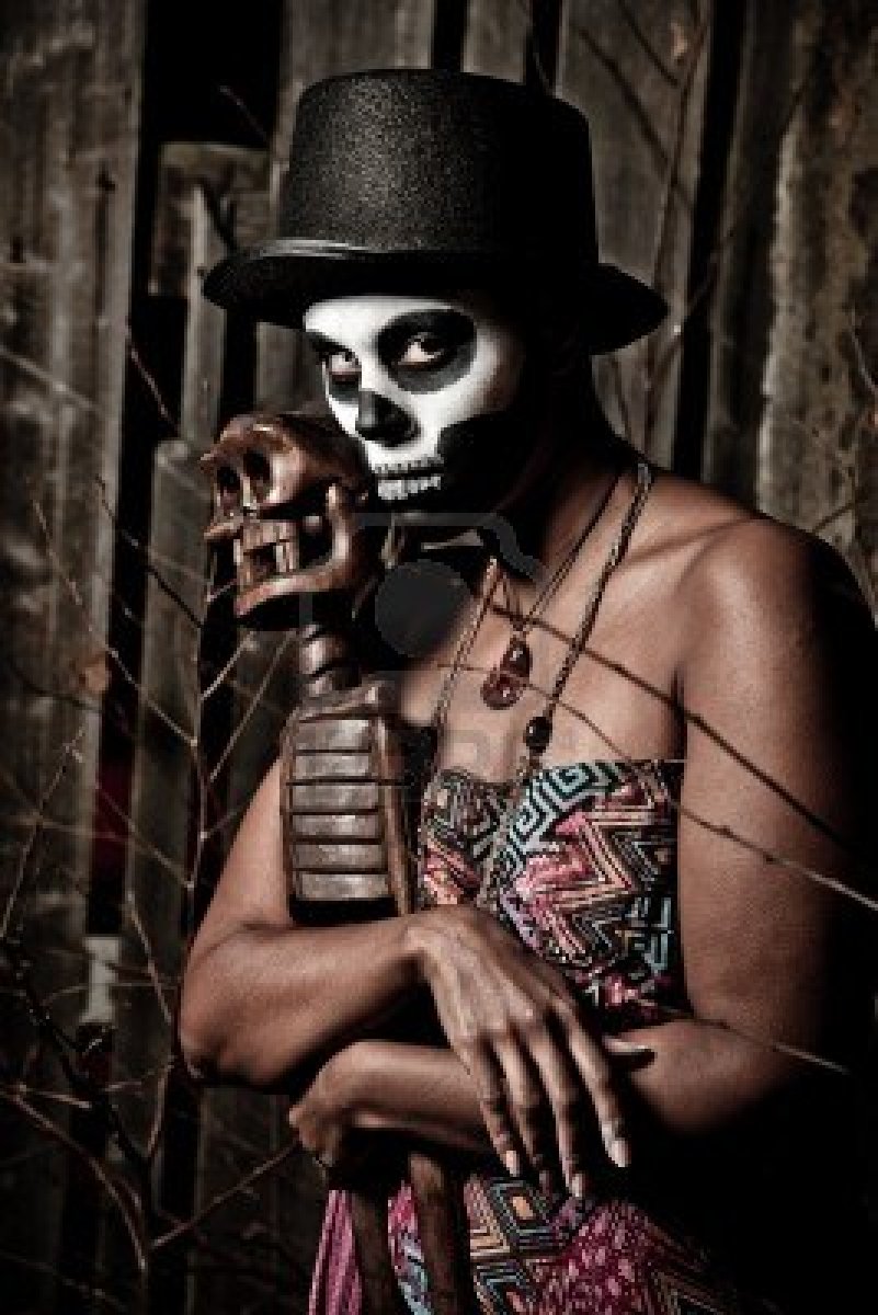 11218593-a-female-voodoo-priestess-with-face-paint.jpg