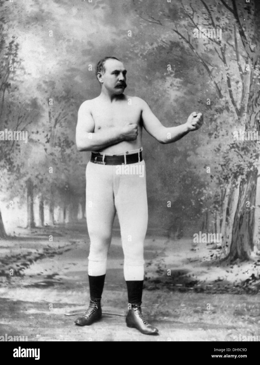 jem-mace-1831-1910-standing-with-fists-raised-english-boxing-champion-DH9C9D.jpg