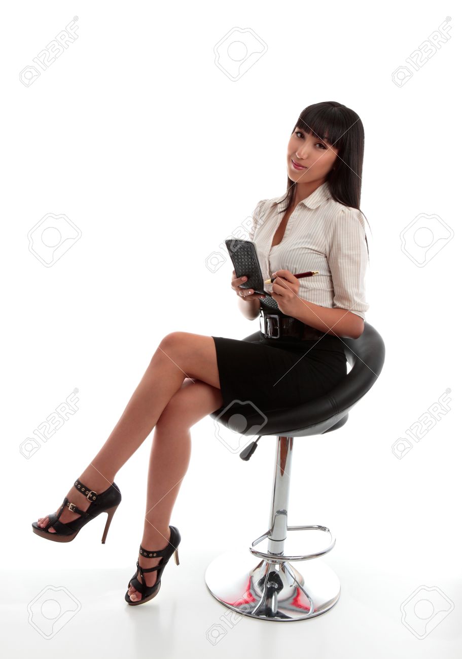 9192480-Beautiful-businesswoman-office-worker-stenographer-wearing-office-attire-sitting-down-with-notepad-a-Stock-Photo.jpg