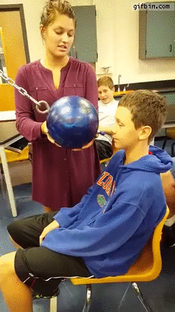 kid-does-pendulum-ball-to-the-face-experiment-in-class.gif