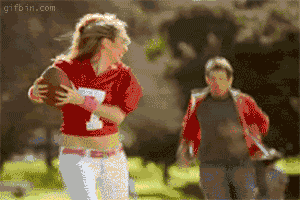 Girl-with-football-gets-tackled.gif