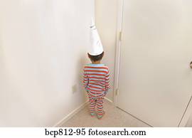 boy-wearing-dunce-cap-in-corner-stock-image__bcp812-95.jpg