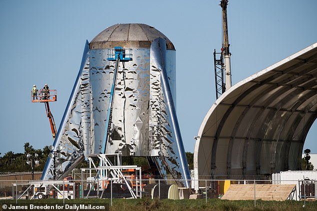 8967708-6631675-Aftermath_The_nose_cone_of_Elon_Musk_s_Mars_rocket_prototype_kno-a-26_1548414433071.jpg