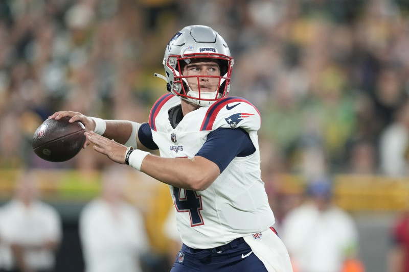 GREEN BAY, WISCONSIN - AUGUST 19: Bailey Zappe #4 of the New England Patriots looks to throw a pass in the second quarter against the Green Bay Packers during a preseason game at Lambeau Field on August 19, 2023 in Green Bay, Wisconsin. (Photo by Patrick McDermott/Getty Images)