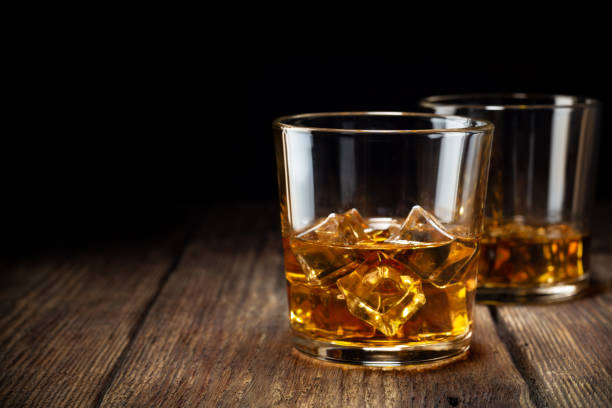 two-glass-of-whiskey-with-ice-picture-id1095608490